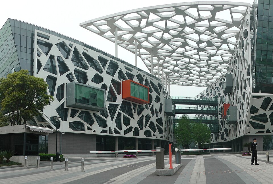 Alibaba Group headquarters building in Hangzhou with a white voronoi-patterned facade and canopy structure
